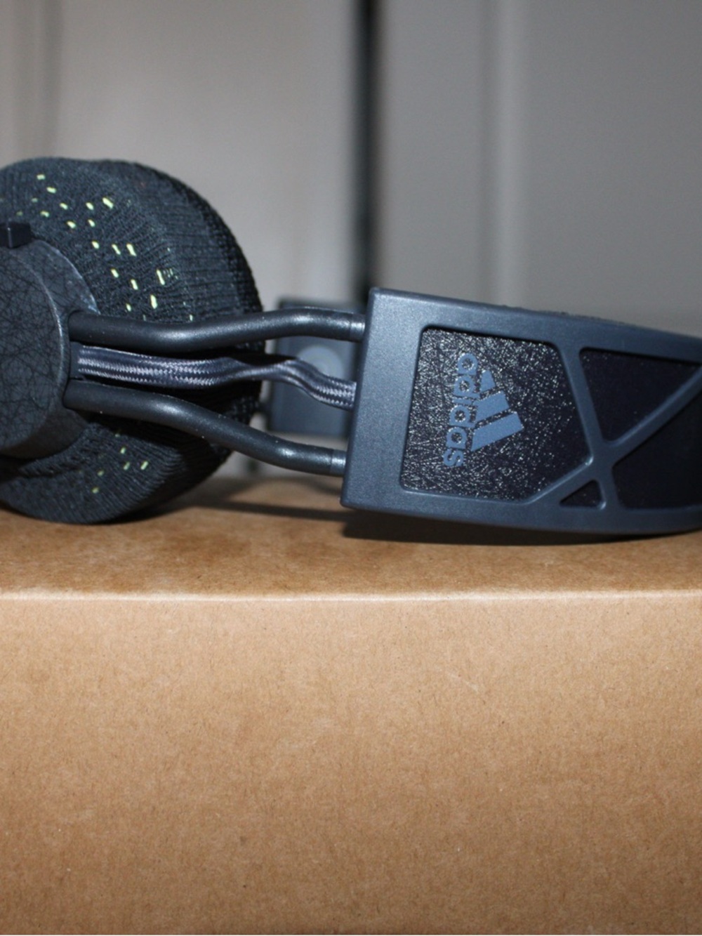 adidas Matte Black On-Ear Headphones with Subtle Green Stitching